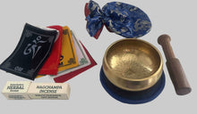 Load image into Gallery viewer, Handmade brass Tibetan singing bowl gift set with wooden striker, blue cushion, Tibetan prayer flags and herbal incense for meditation and sound healing.
