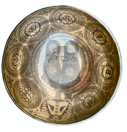 Singing bowl with foot designs 