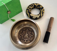 Load image into Gallery viewer, singing bowl with decorative design and wooden striking stick with buddha.
